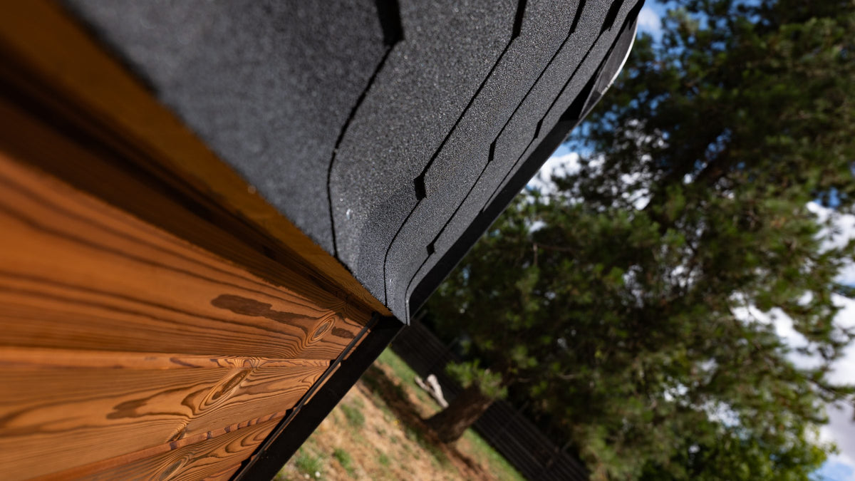 Black Katepal roofing above Thermowood cladding